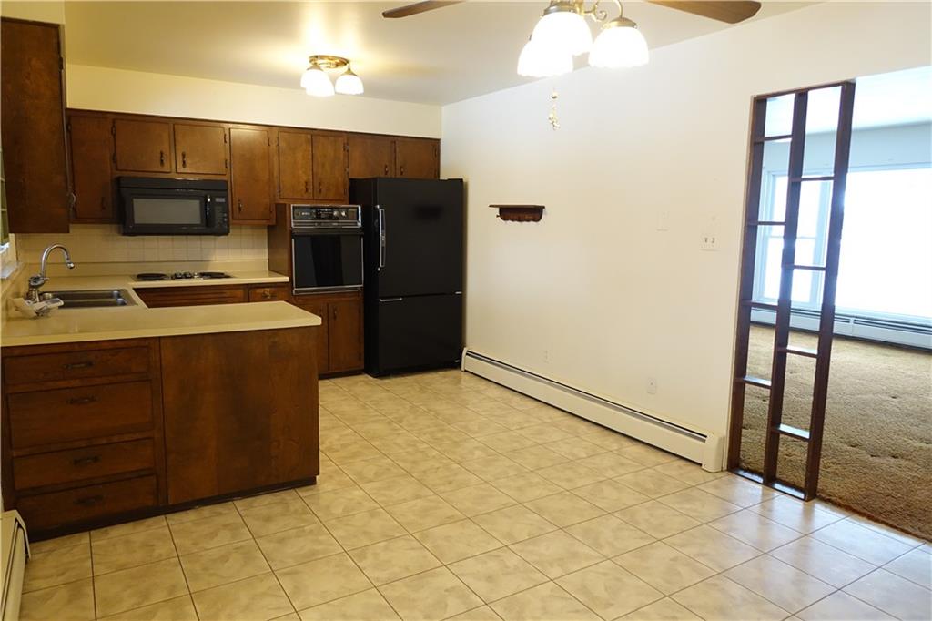 115 Randy Drive Butler, PA 16002 - Photo 6 of 25 a kitchen with stainless steel appliances a refrigerator and a stove