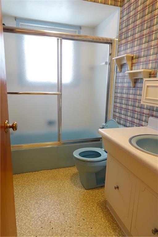 115 Randy Drive Butler, PA 16002 - Photo 10 of 25 a bathroom with a granite countertop bathtub sink and toilet