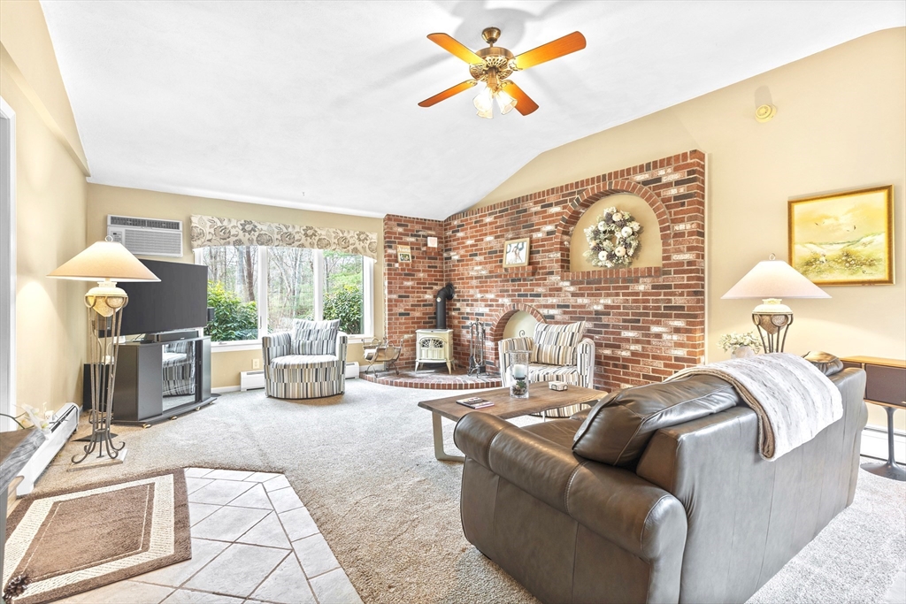 116 River Street Middleton, MA 01949 - Photo 11 of 32 a living room with furniture and a large window
