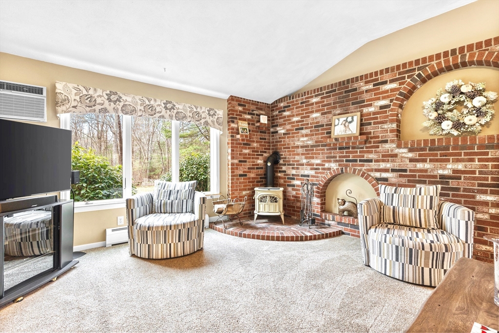 116 River Street Middleton, MA 01949 - Photo 12 of 32 a living room with furniture fireplace and a flat screen tv
