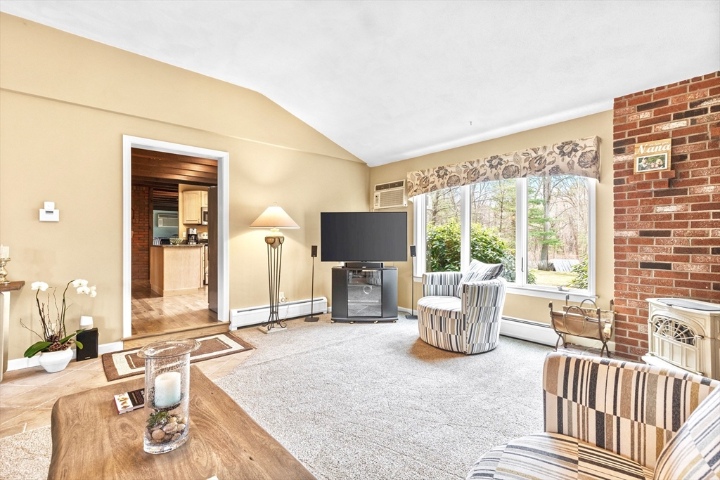 116 River Street Middleton, MA 01949 - Photo 13 of 32 a living room with furniture and a flat screen tv