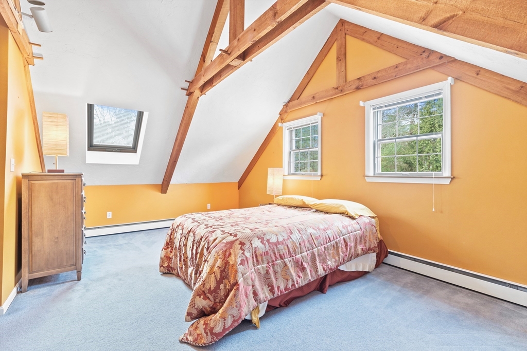 116 River Street Middleton, MA 01949 - Photo 19 of 32 a bedroom with a bed and a window