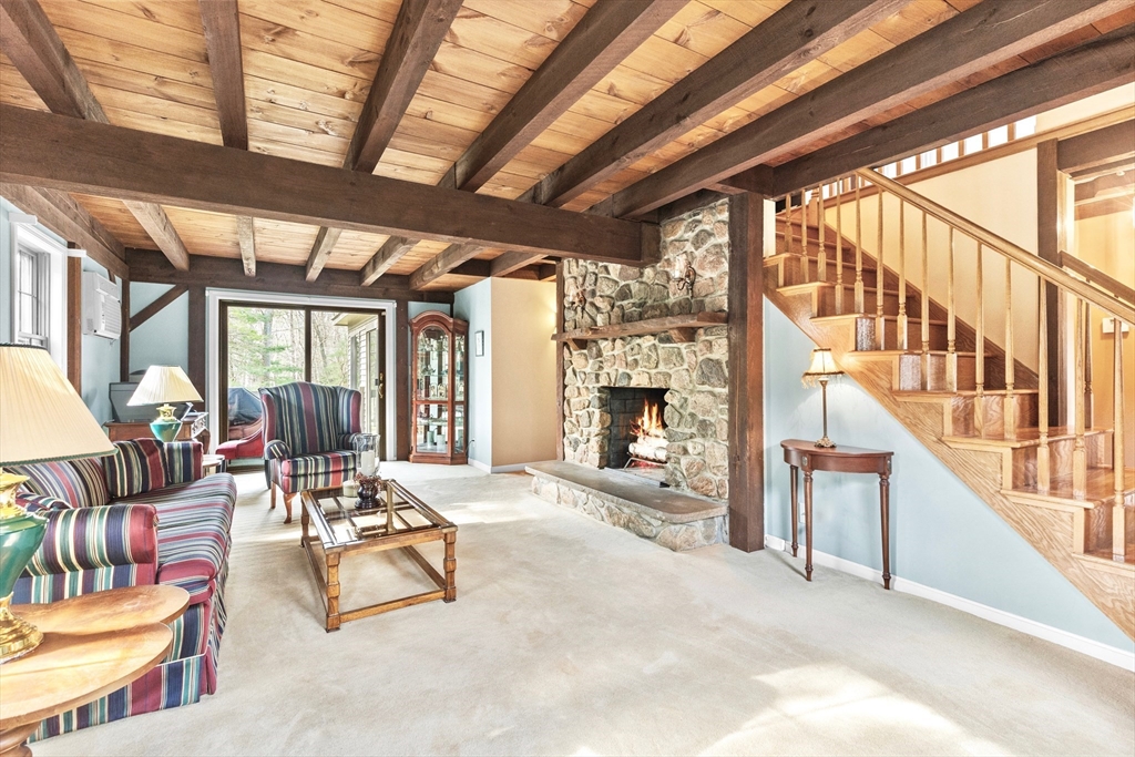 116 River Street Middleton, MA 01949 - Photo 2 of 32 a living room with furniture and a fireplace