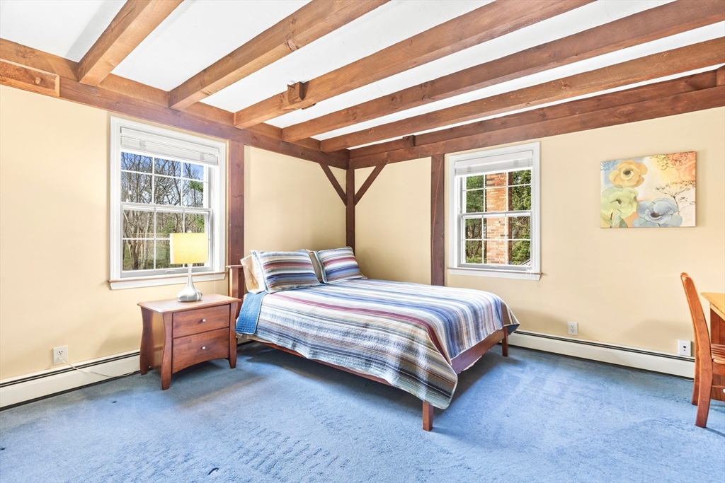116 River Street Middleton, MA 01949 - Photo 21 of 32 a bedroom with a bed and a window