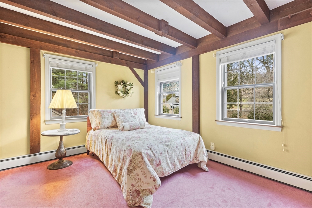 116 River Street Middleton, MA 01949 - Photo 23 of 32 a bedroom with a bed and a large window with outer view
