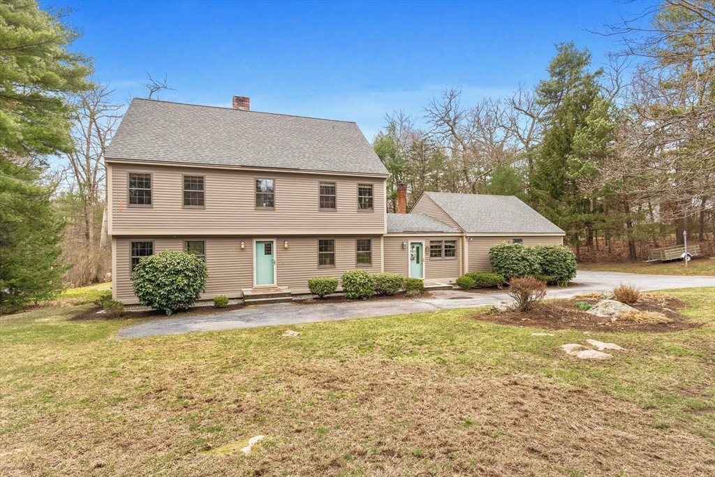 116 River Street Middleton, MA 01949 - Photo 25 of 32 a front view of a house with a yard