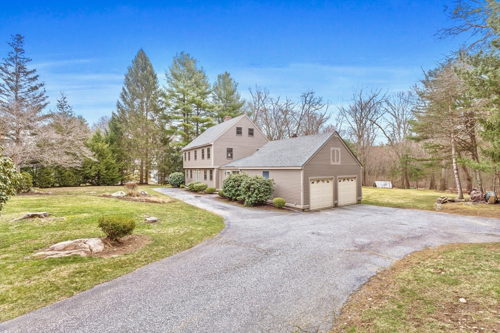 116 River Street Middleton, MA 01949 - Photo 26 of 32 a front view of a house with garden