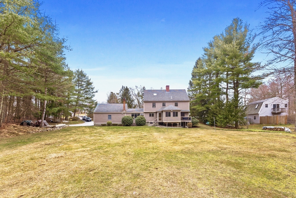 116 River Street Middleton, MA 01949 - Photo 29 of 32 a view of a swimming pool with a house in the background