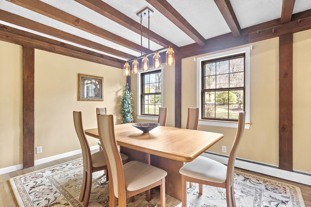 116 River Street Middleton, MA 01949 - Photo 9 of 32 a view of a dining room with furniture and wooden floor