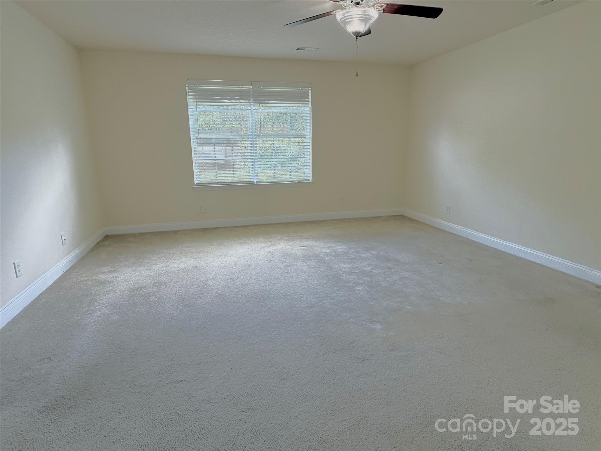 7534 April Mist Trail Huntersville, NC 28078 - Photo 17 of 47 an empty room with a window