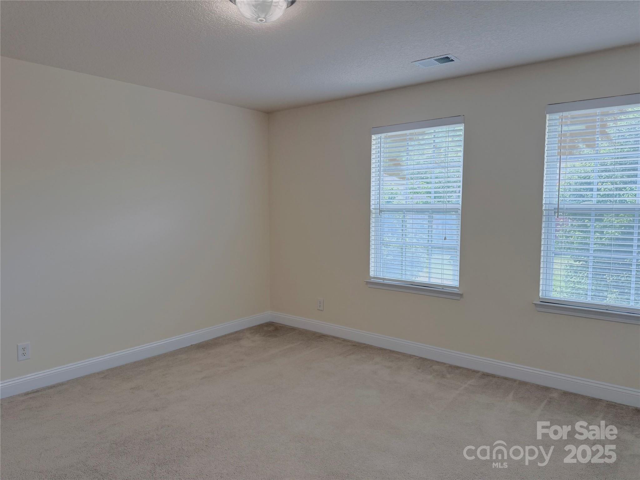 7534 April Mist Trail Huntersville, NC 28078 - Photo 24 of 47 an empty room with a window