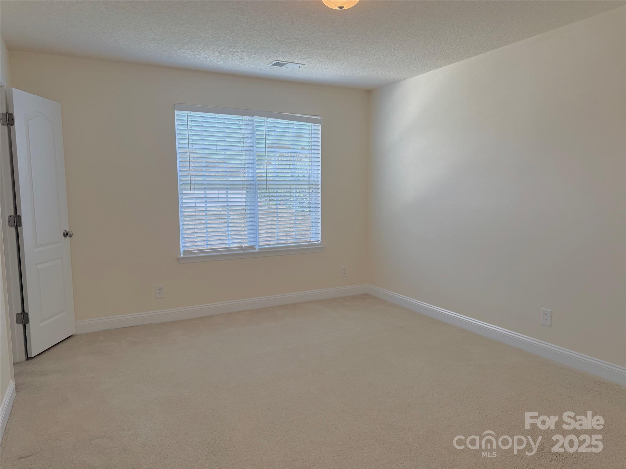 7534 April Mist Trail Huntersville, NC 28078 - Photo 26 of 47 an empty room with a window
