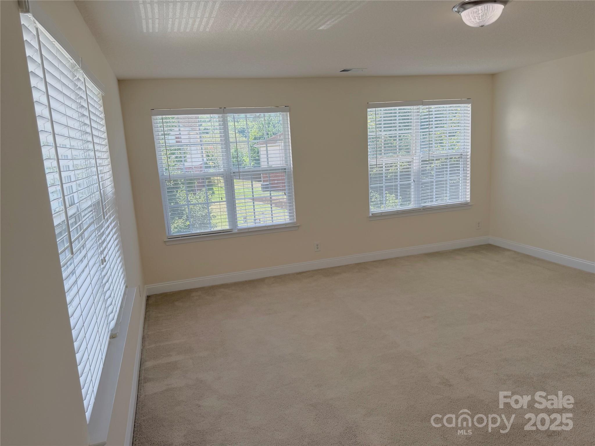 7534 April Mist Trail Huntersville, NC 28078 - Photo 30 of 47 an empty room with a window