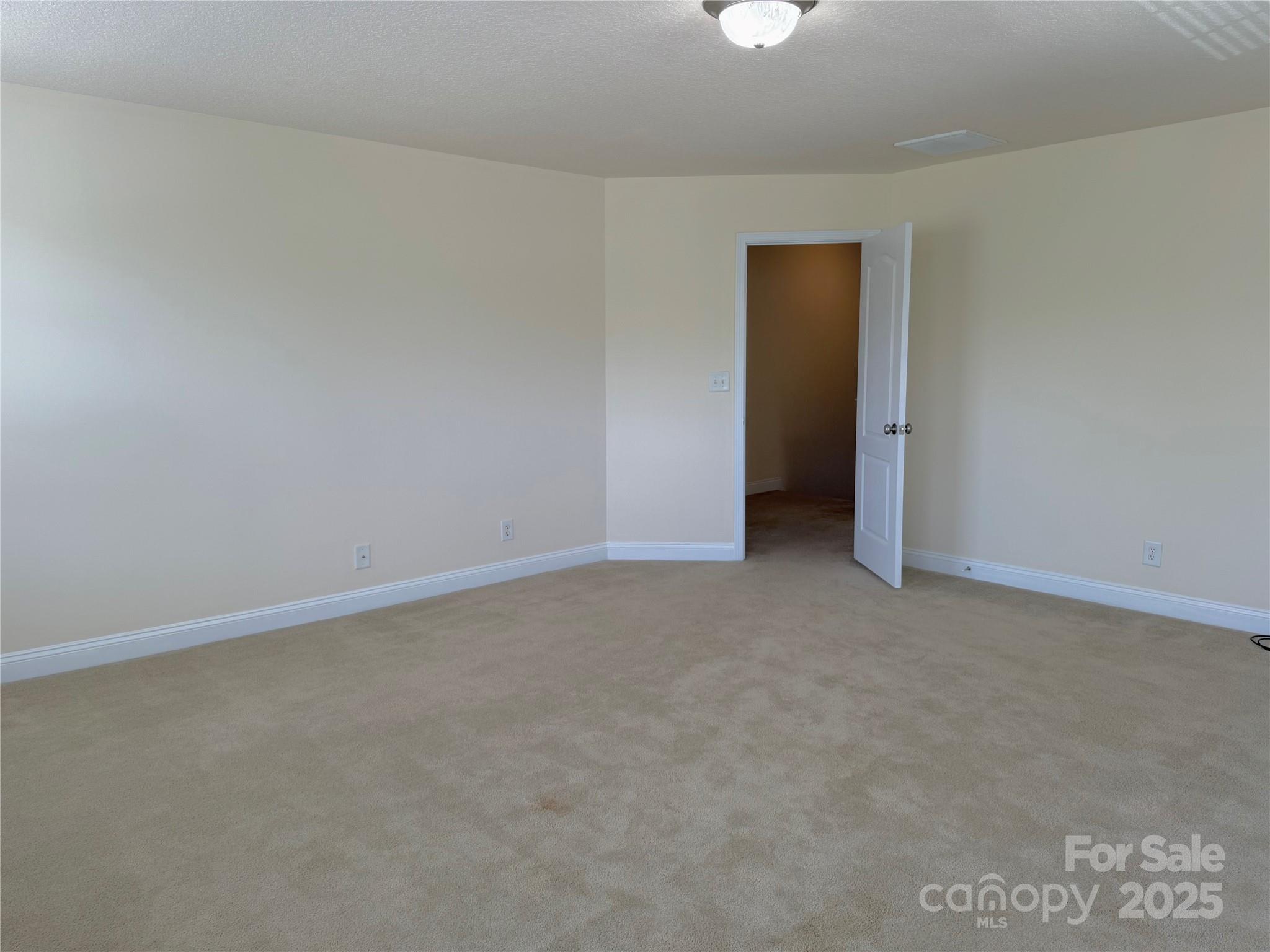 7534 April Mist Trail Huntersville, NC 28078 - Photo 31 of 47 a view of an empty room