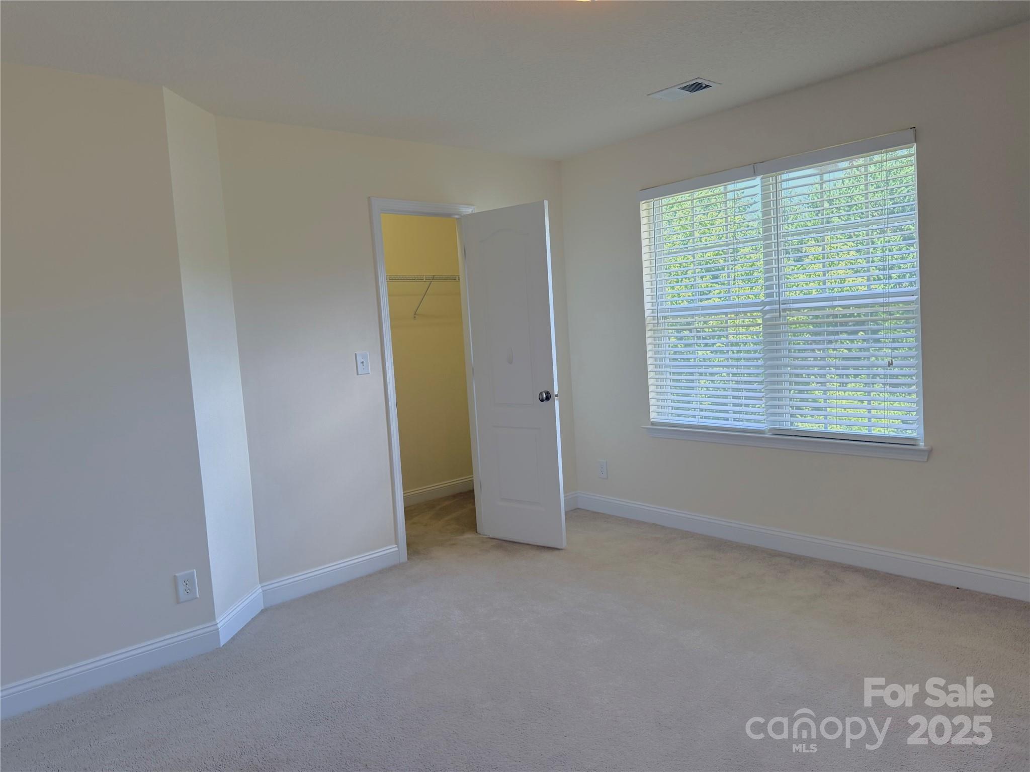 7534 April Mist Trail Huntersville, NC 28078 - Photo 35 of 47 an empty room with a window