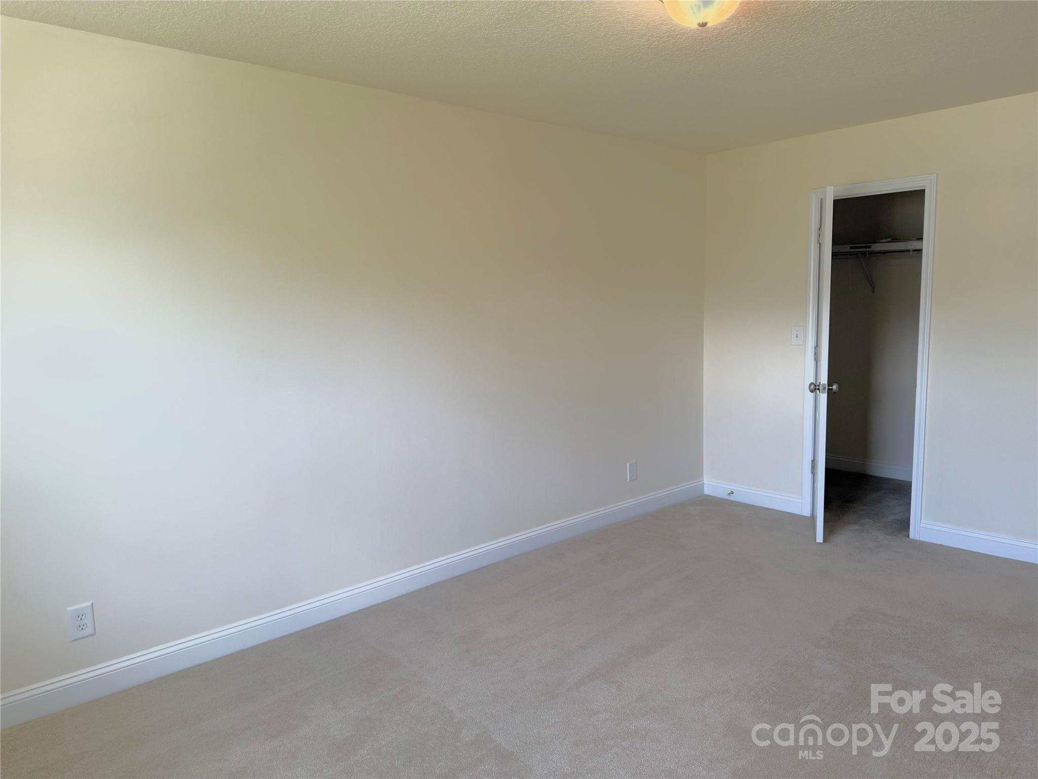 7534 April Mist Trail Huntersville, NC 28078 - Photo 40 of 47 a view of an empty room