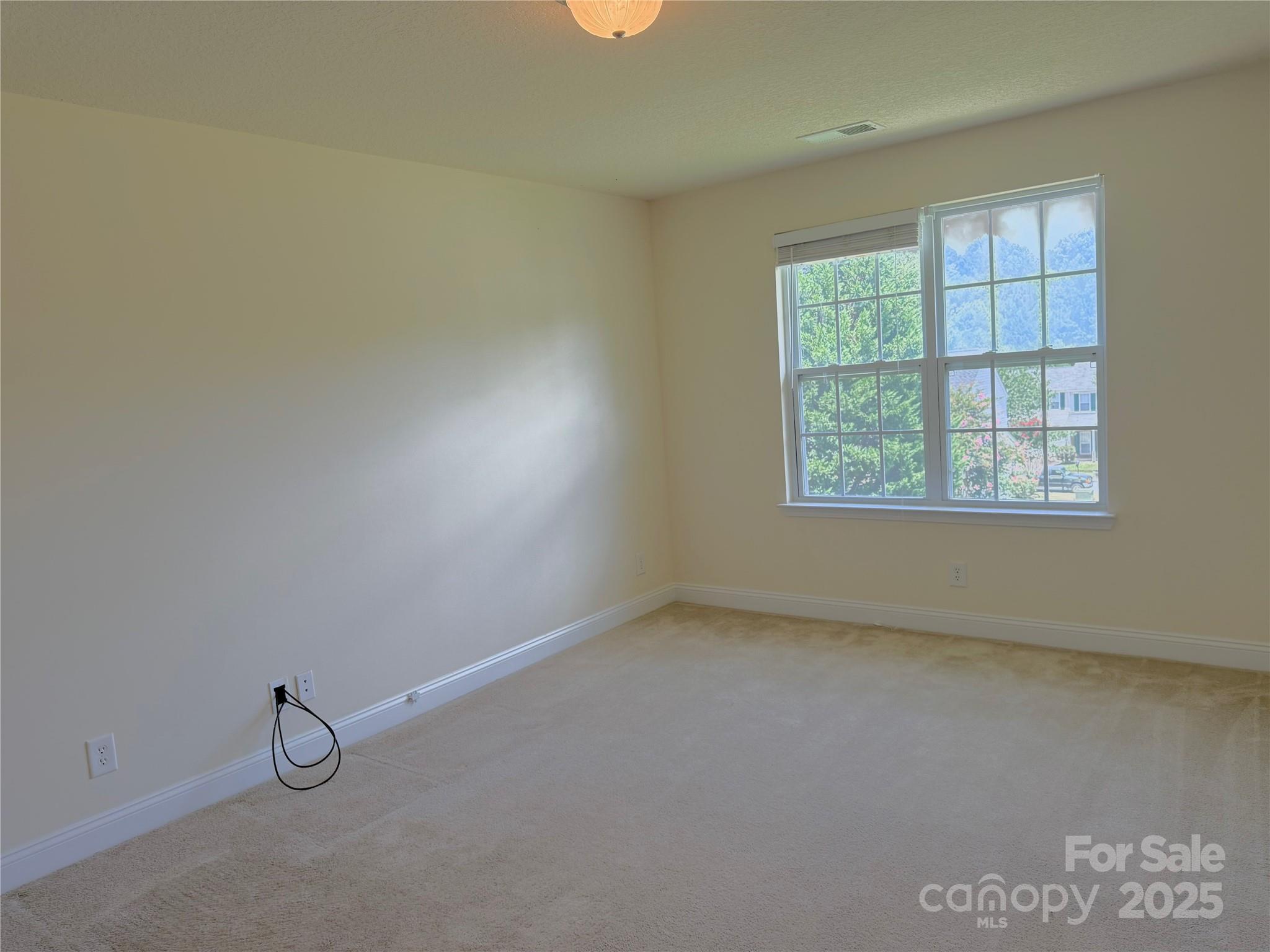7534 April Mist Trail Huntersville, NC 28078 - Photo 41 of 47 an empty room with windows