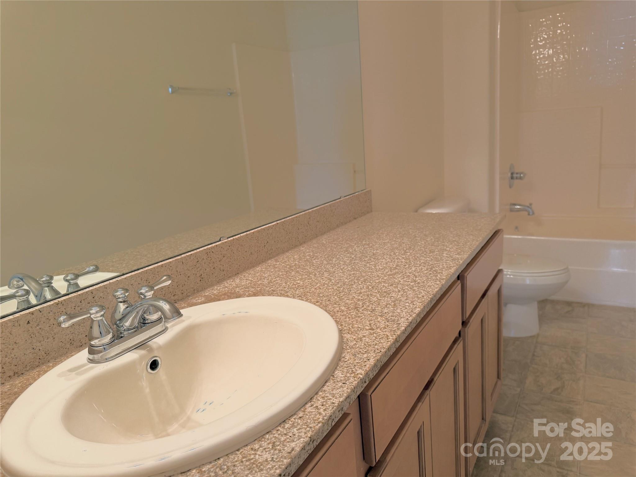 7534 April Mist Trail Huntersville, NC 28078 - Photo 42 of 47 a bathroom with a granite countertop sink and white vanity