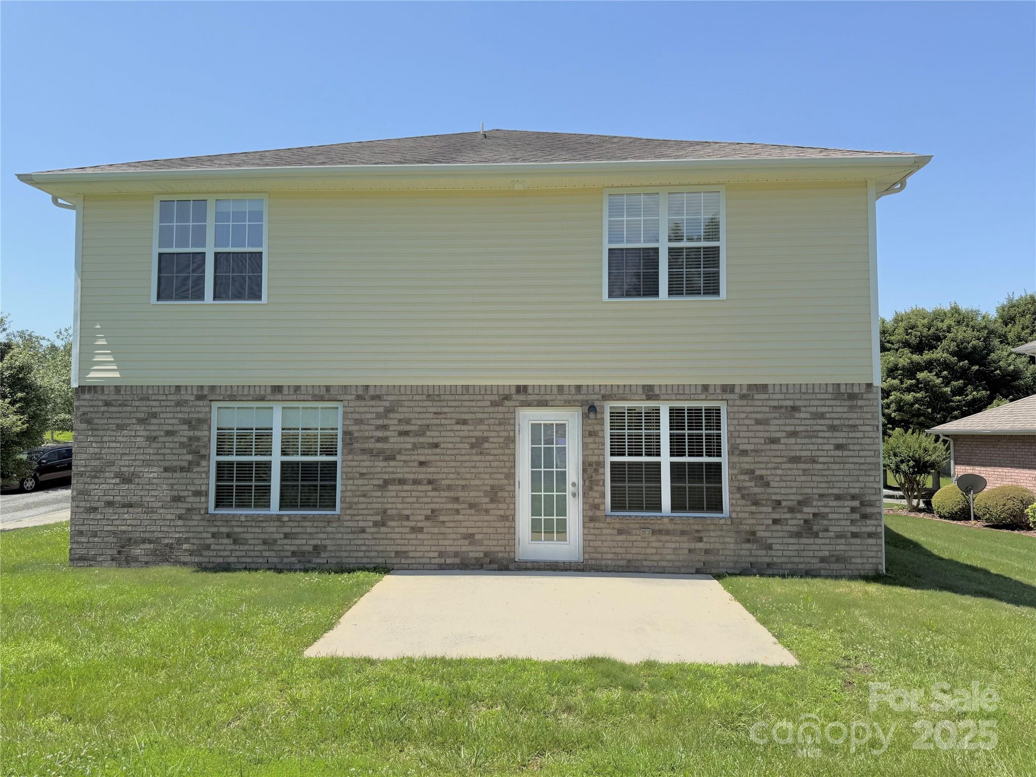 7534 April Mist Trail Huntersville, NC 28078 - Photo 46 of 47 a front view of a house with a yard