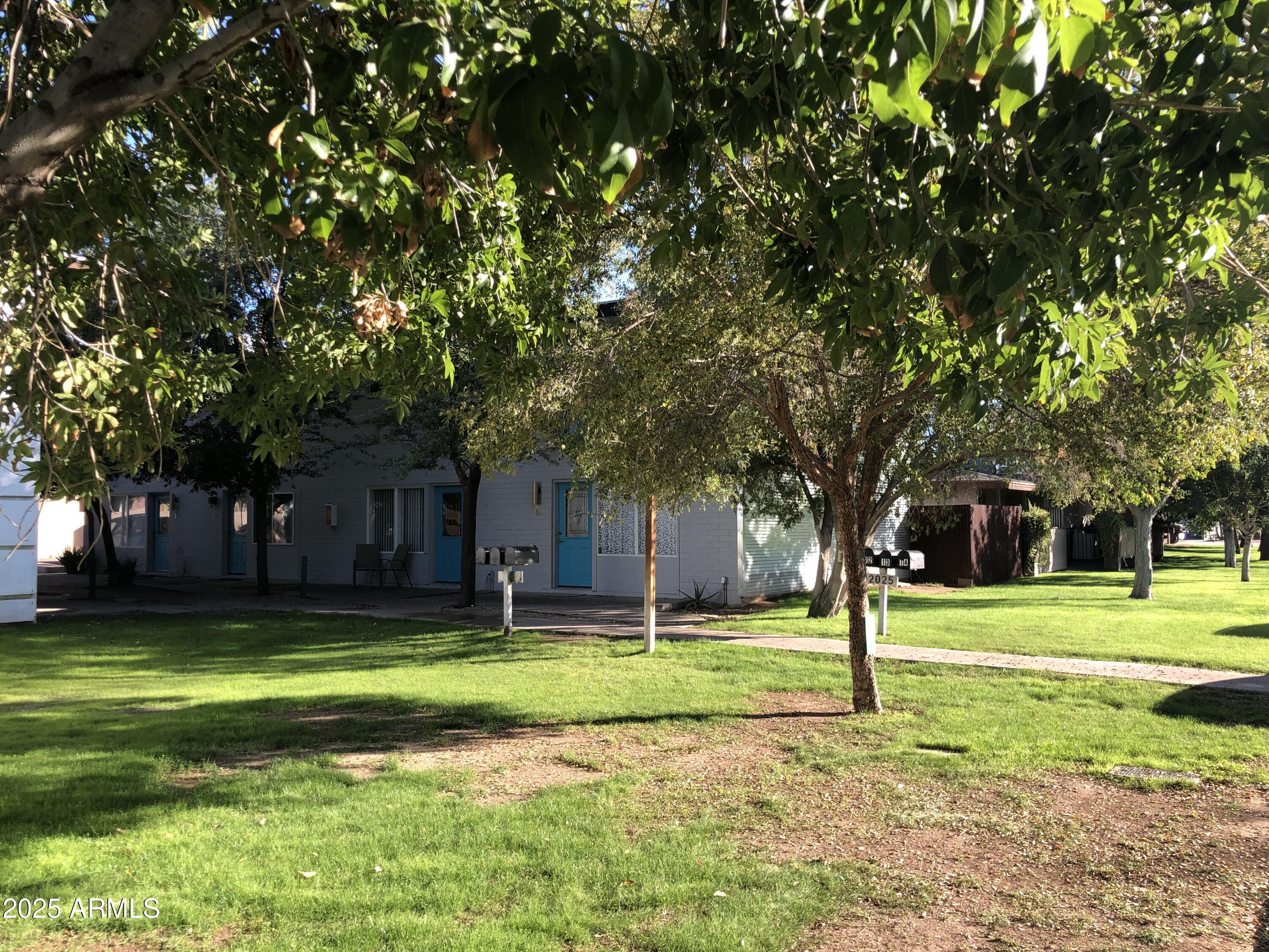 2025 South Granada Drive, Unit 12 Tempe, AZ 85282 - Photo 2 of 35 a view of a park with large trees