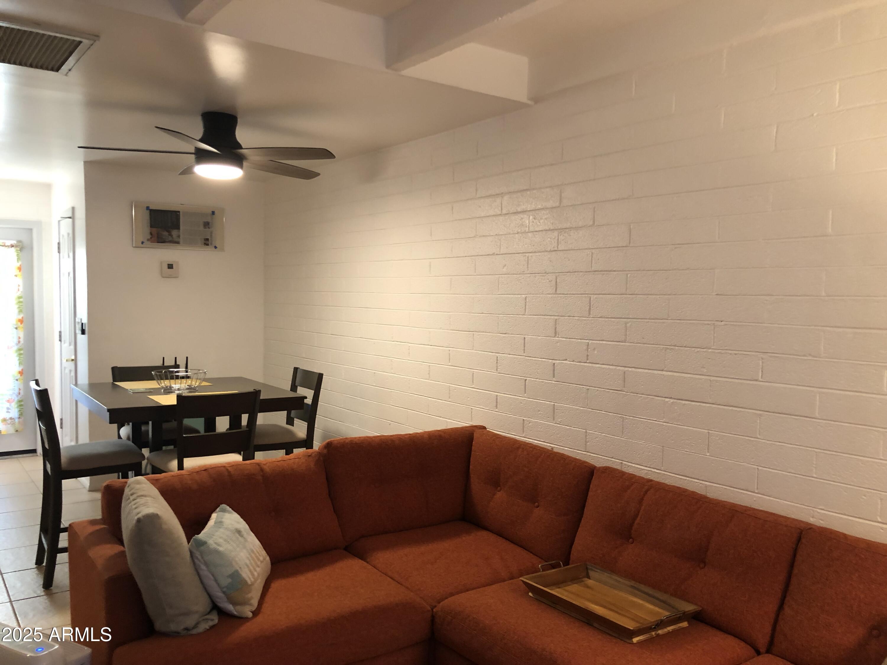 2025 South Granada Drive, Unit 12 Tempe, AZ 85282 - Photo 35 of 35 a living room with furniture a ceiling fan and a rug