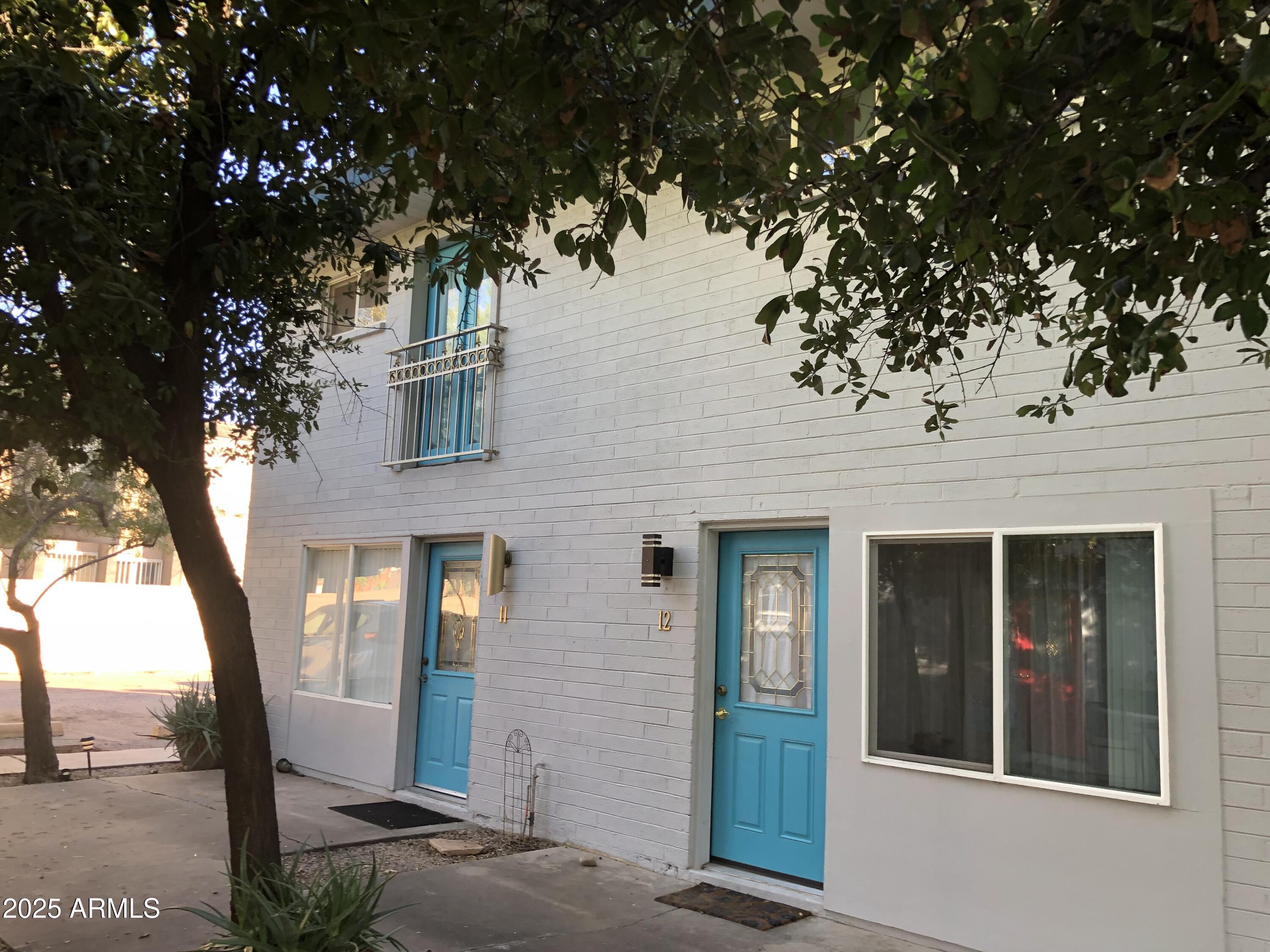 2025 South Granada Drive, Unit 12 Tempe, AZ 85282 - Photo 4 of 35 front view of a building with a tree