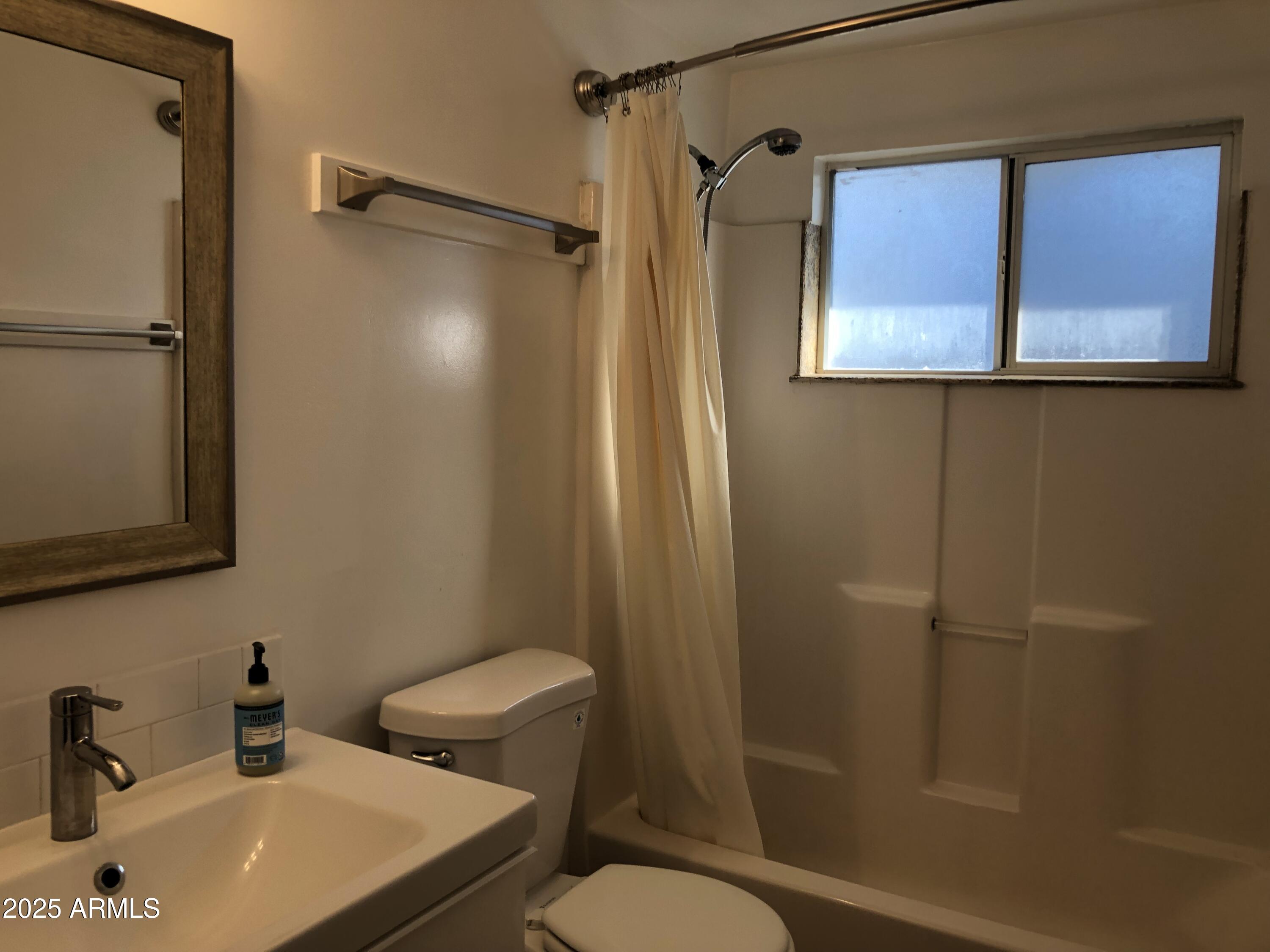2025 South Granada Drive, Unit 12 Tempe, AZ 85282 - Photo 6 of 35 a bathroom with a sink a toilet and shower
