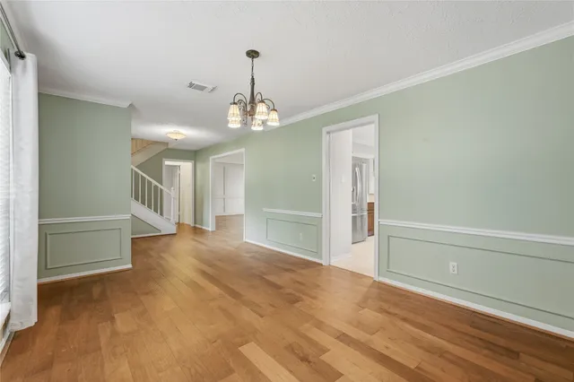 a kitchen with a sink refrigerator and microwave