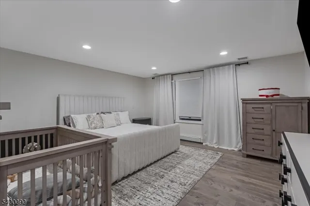 a bedroom with a bed and cabinets