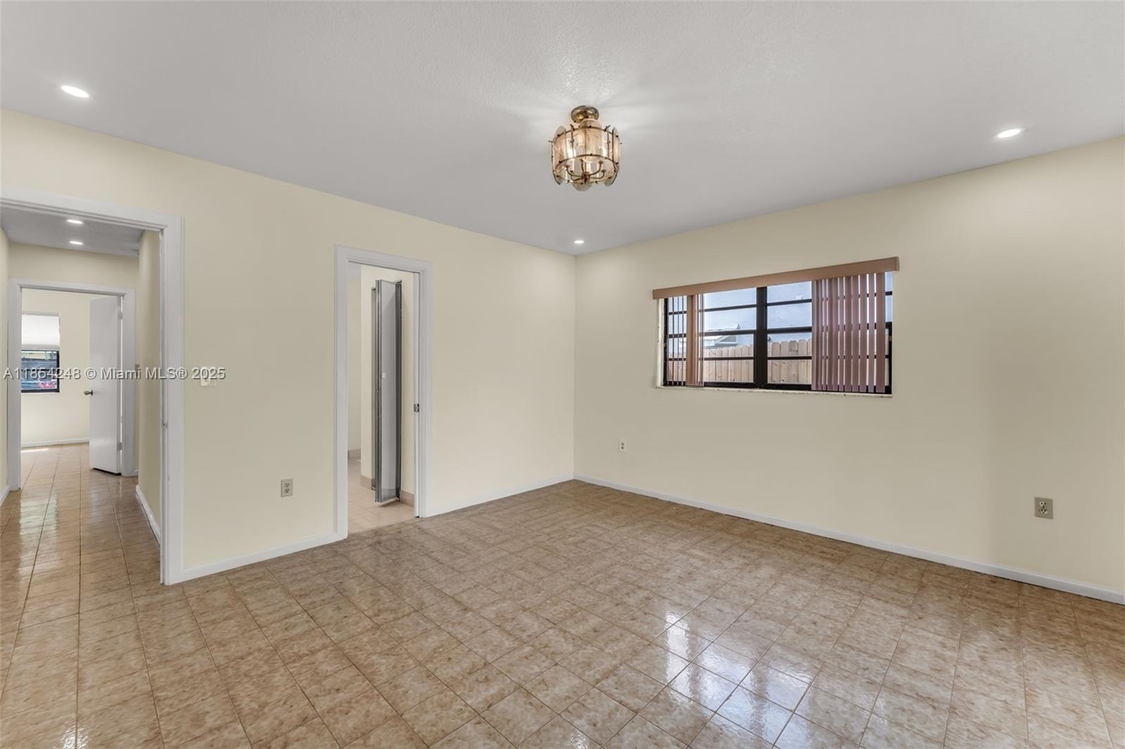 9130 Southwest 101st Avenue Miami, FL 33176 - Photo 16 of 35 a view of an empty room with a window