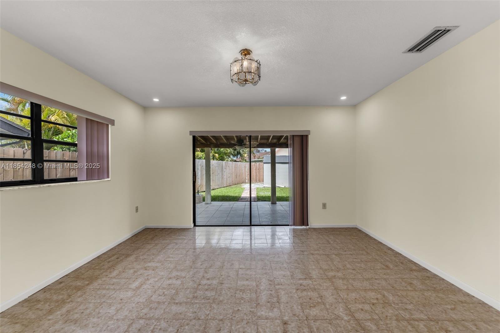 9130 Southwest 101st Avenue Miami, FL 33176 - Photo 17 of 35 a view of an empty room with a window
