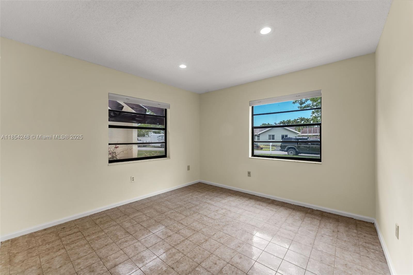 9130 Southwest 101st Avenue Miami, FL 33176 - Photo 21 of 35 an empty room with windows