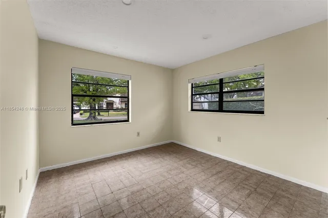 an empty room with windows