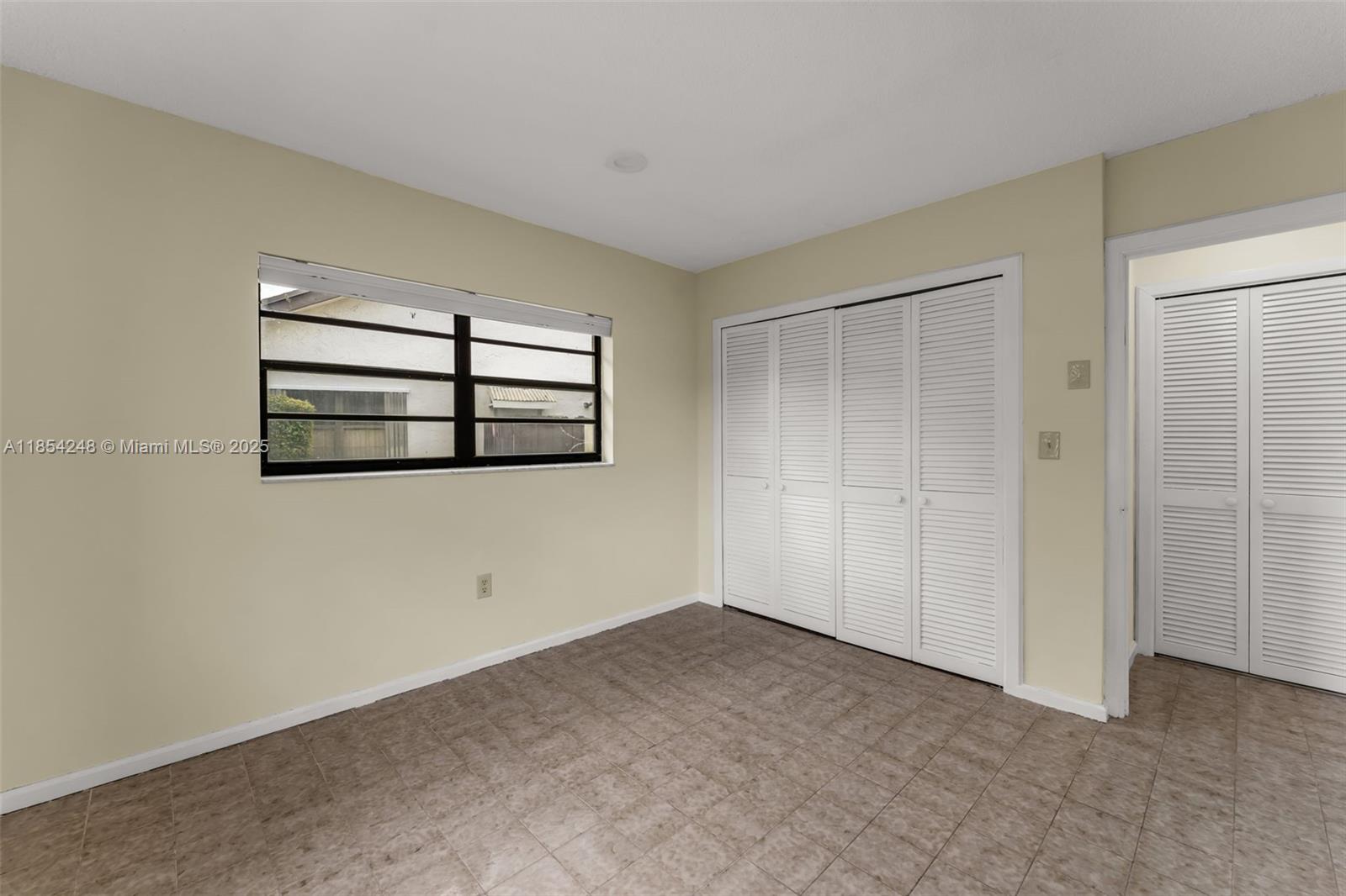 9130 Southwest 101st Avenue Miami, FL 33176 - Photo 24 of 35 an empty room with windows