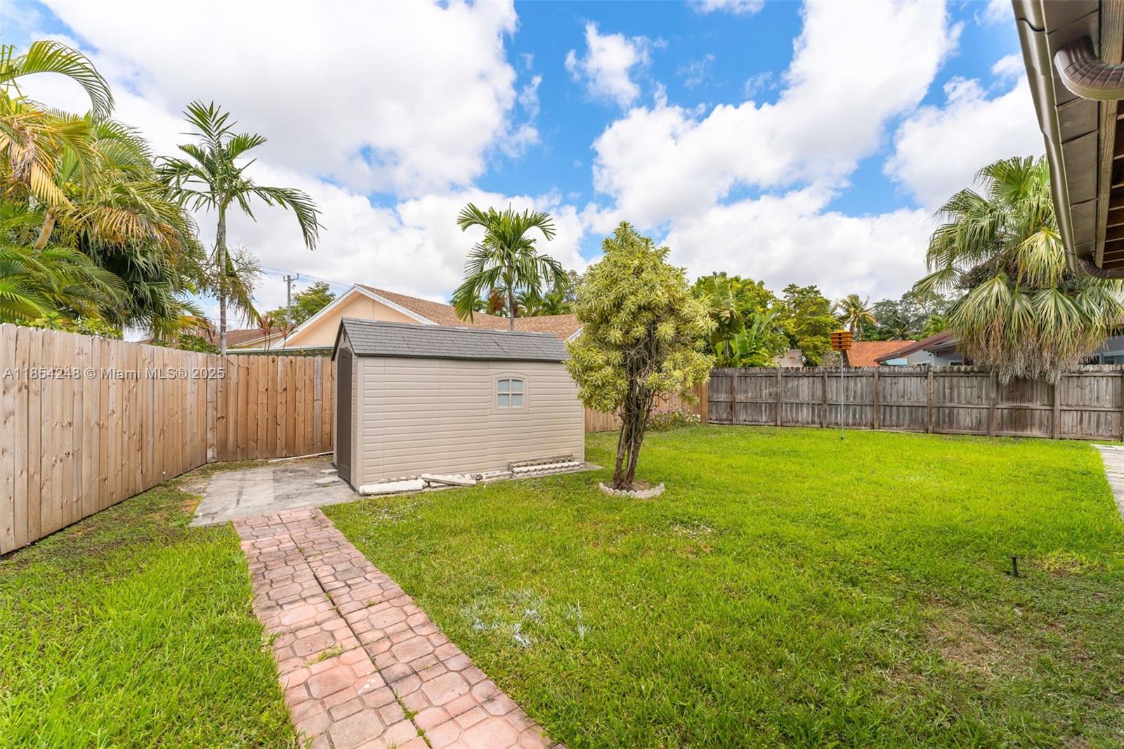 9130 Southwest 101st Avenue Miami, FL 33176 - Photo 28 of 35 a backyard of a house with lots of green space