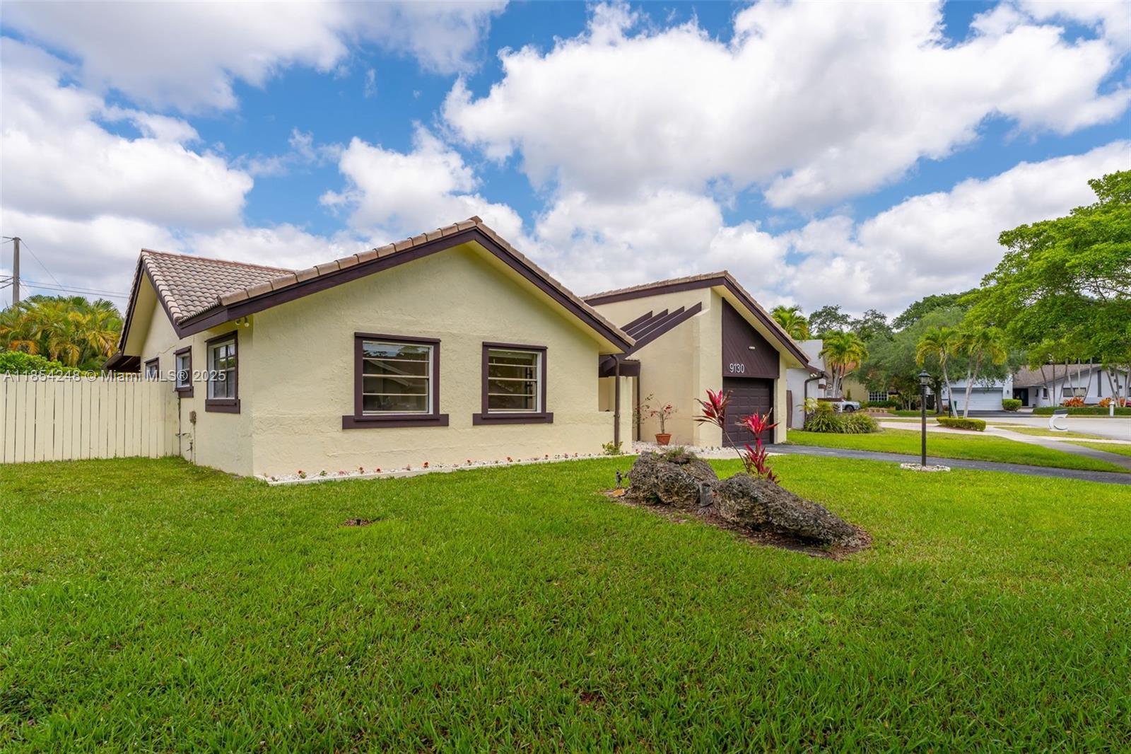 9130 Southwest 101st Avenue Miami, FL 33176 - Photo 3 of 35 a front view of house with yard and green space