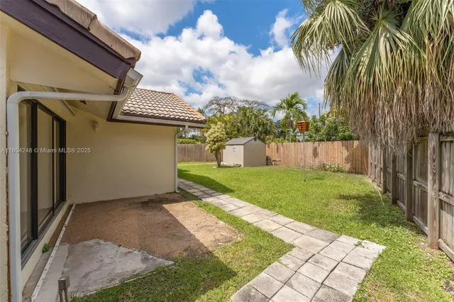 a view of a back yard of the house