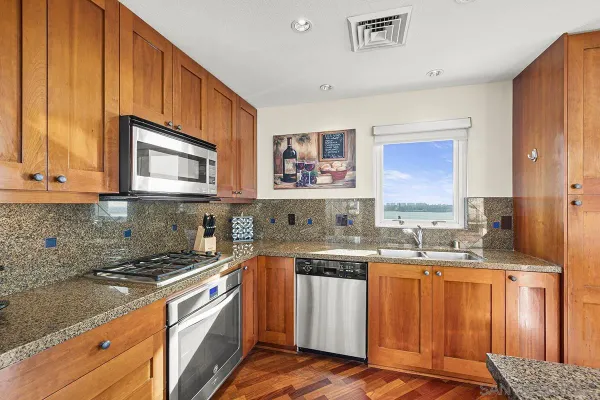 a kitchen with a sink cabinets and window