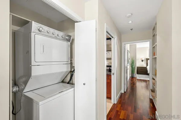 a view of hallway with wooden floor
