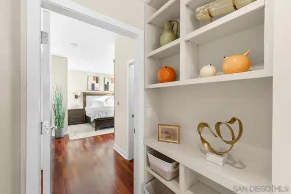 a living room with furniture and a book shelf