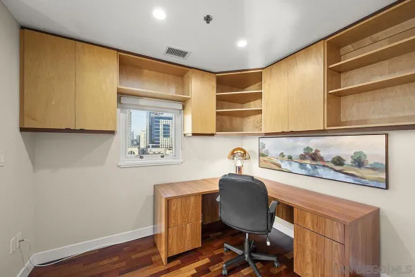 a view of workspace with wooden floor