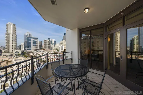 a view of a balcony with chairs