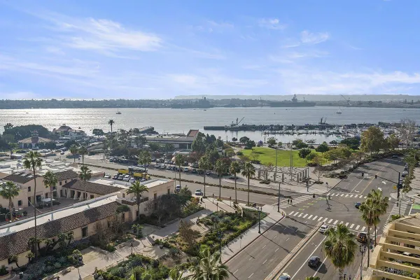 a view of a lake with houses in the back