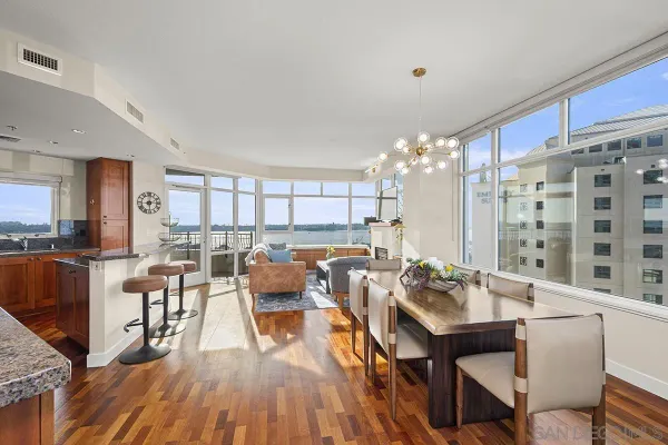 a view of a dining room with furniture and wooden floor