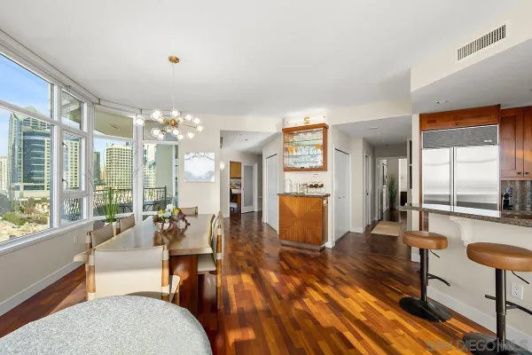 a living room with fireplace furniture and a large window