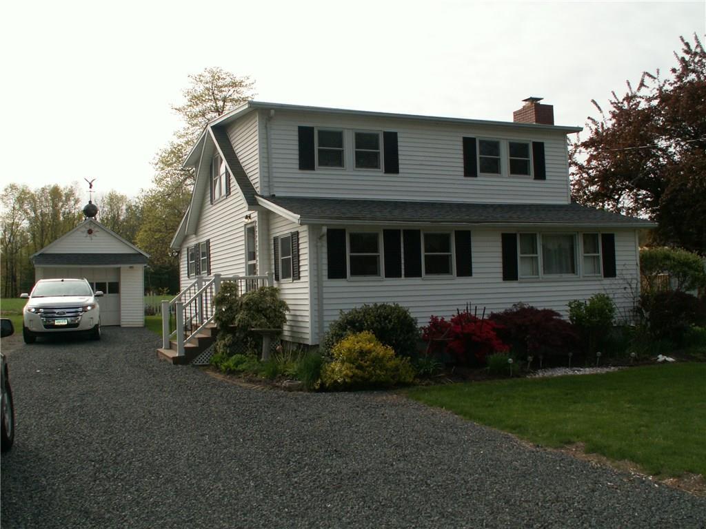 158 Cottage Road Enfield, CT 06082 - Photo 1 of 1 a front view of a house with a garden and plants