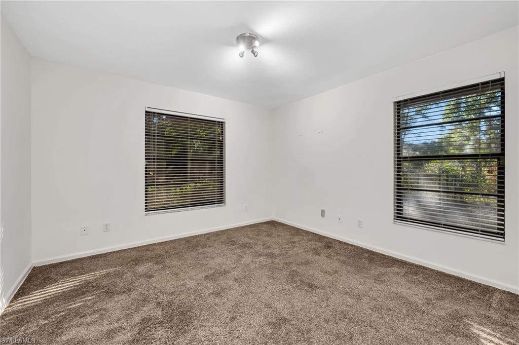 5191 Mahogany Ridge Drive Naples, FL 34119 - Photo 13 of 18 a view of empty room with window