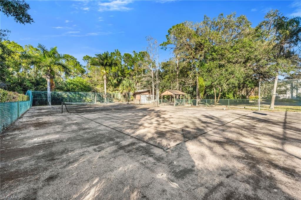 5191 Mahogany Ridge Drive Naples, FL 34119 - Photo 7 of 18 a view of outdoor space with trees