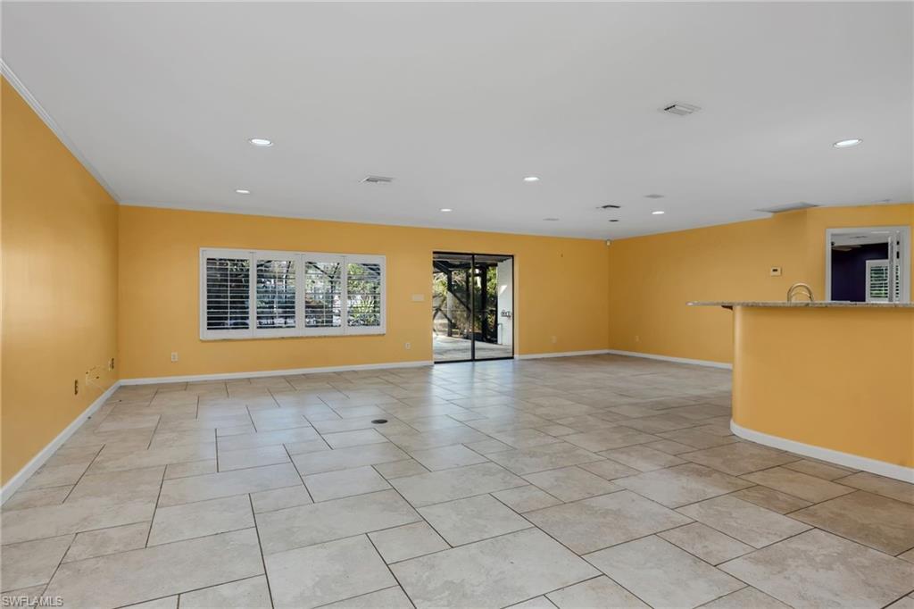 5191 Mahogany Ridge Drive Naples, FL 34119 - Photo 8 of 18 a view of an empty room with a window