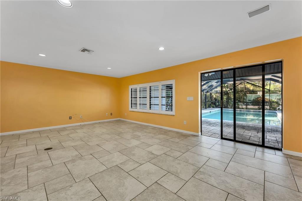 5191 Mahogany Ridge Drive Naples, FL 34119 - Photo 9 of 18 a view of an empty room with window